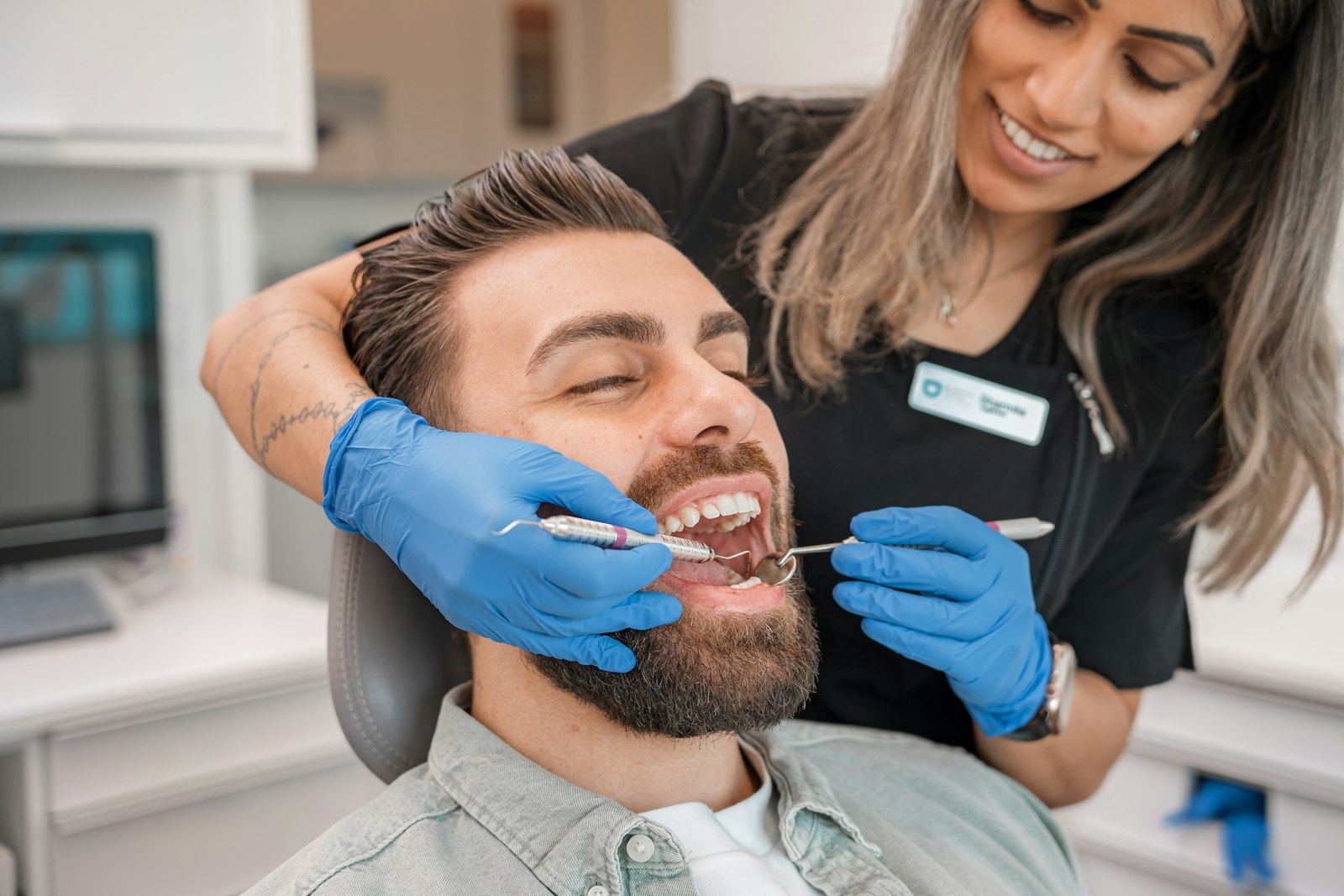 A dentist examining a patient's teeth
